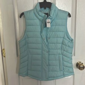 This is a brand new Gap puffer vest jacket in light teal color.